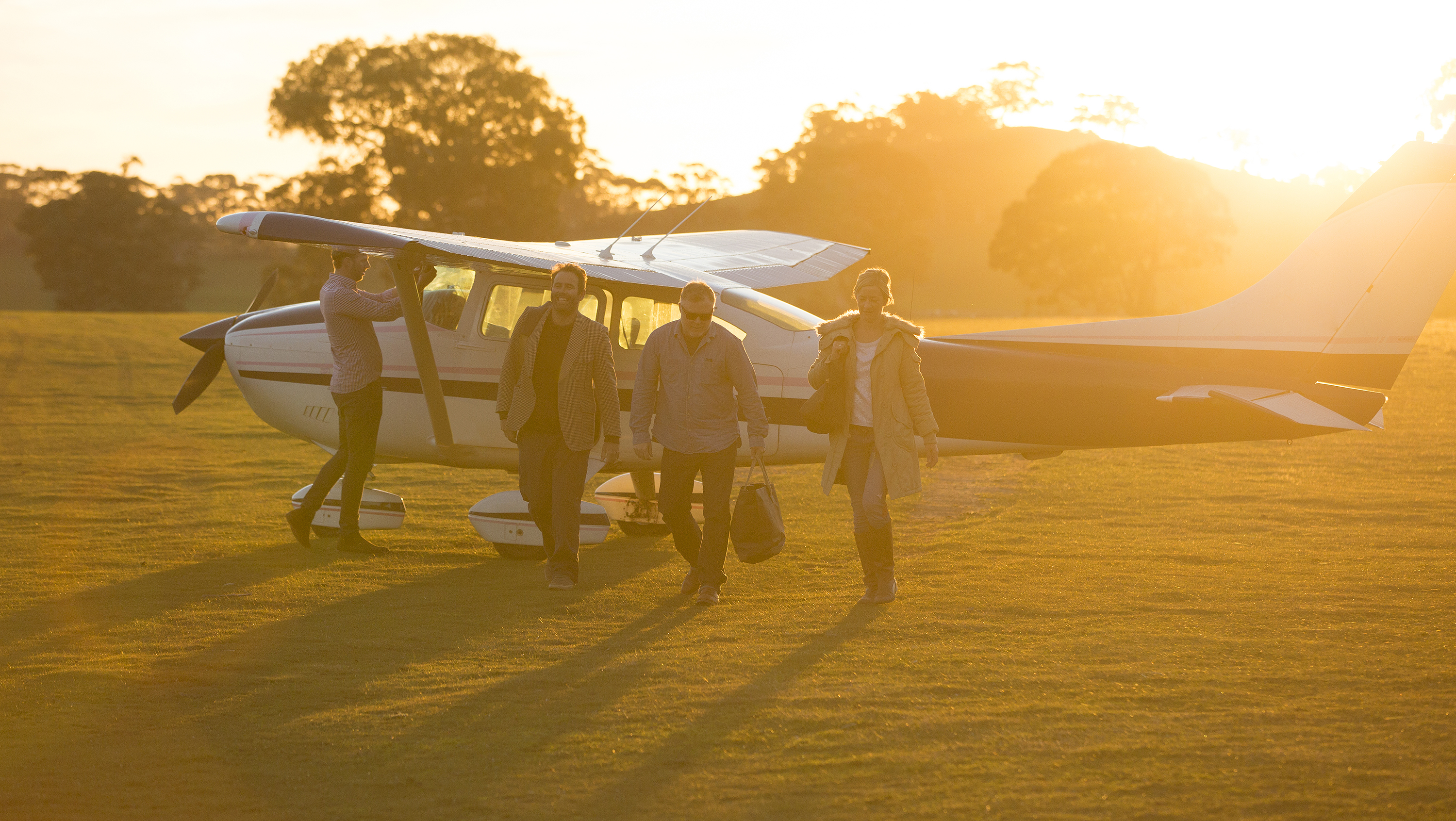 Plane riding at sunset